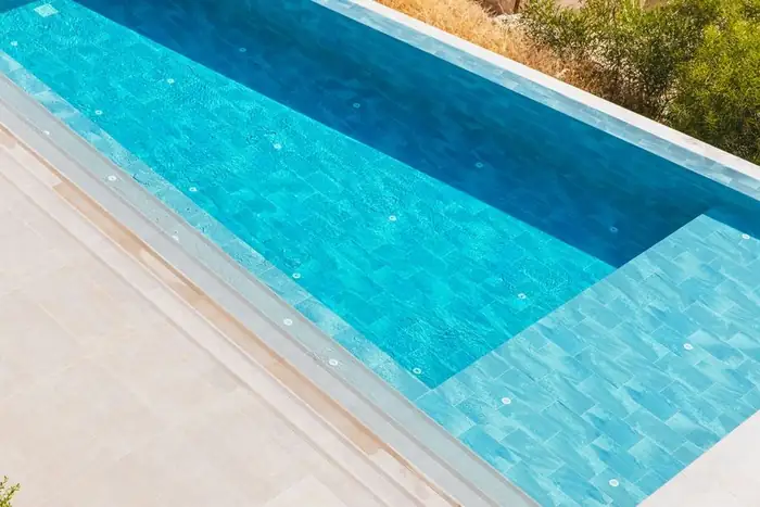 Concrete swimming pool with tiled interior